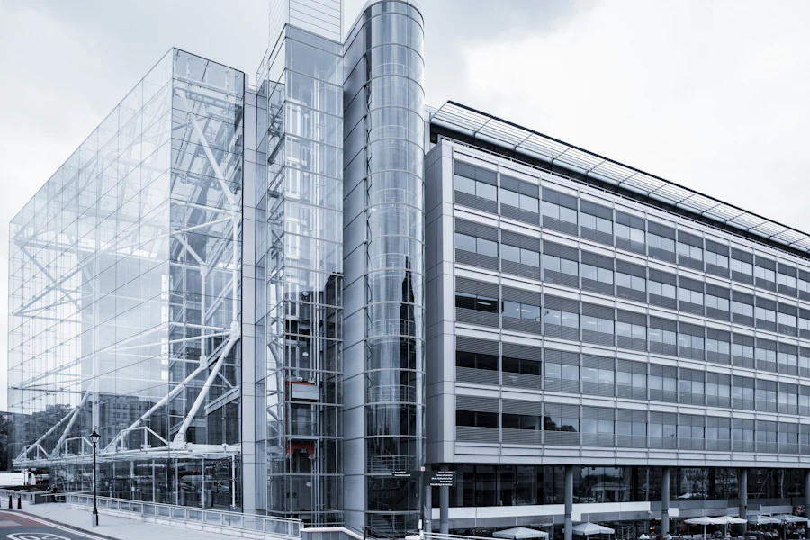 Glass and steel office buildings with a full-height glazed atrium between them